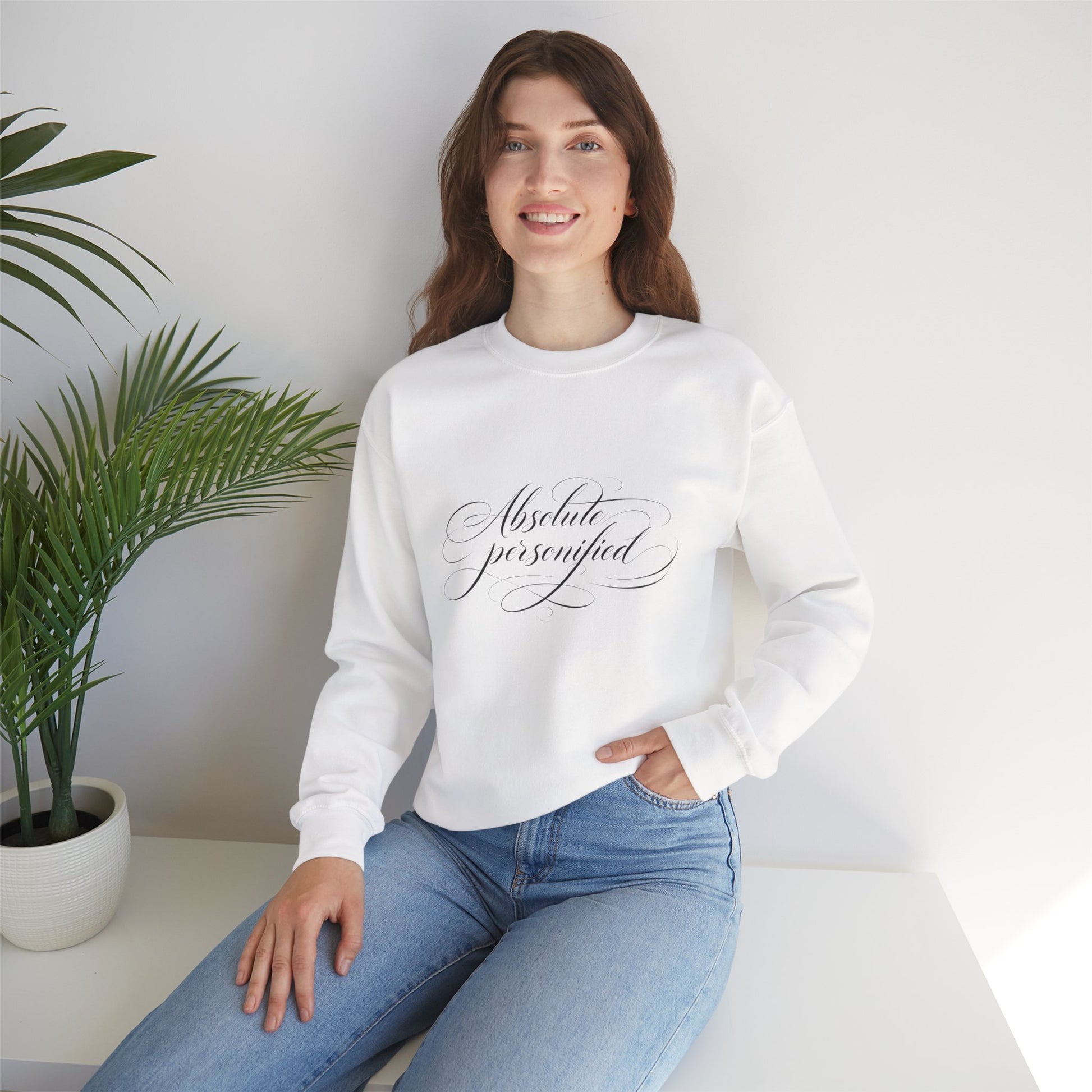 Black crewneck sweatshirt by Printify with "Absolute Perfection" script logo printed on the front.