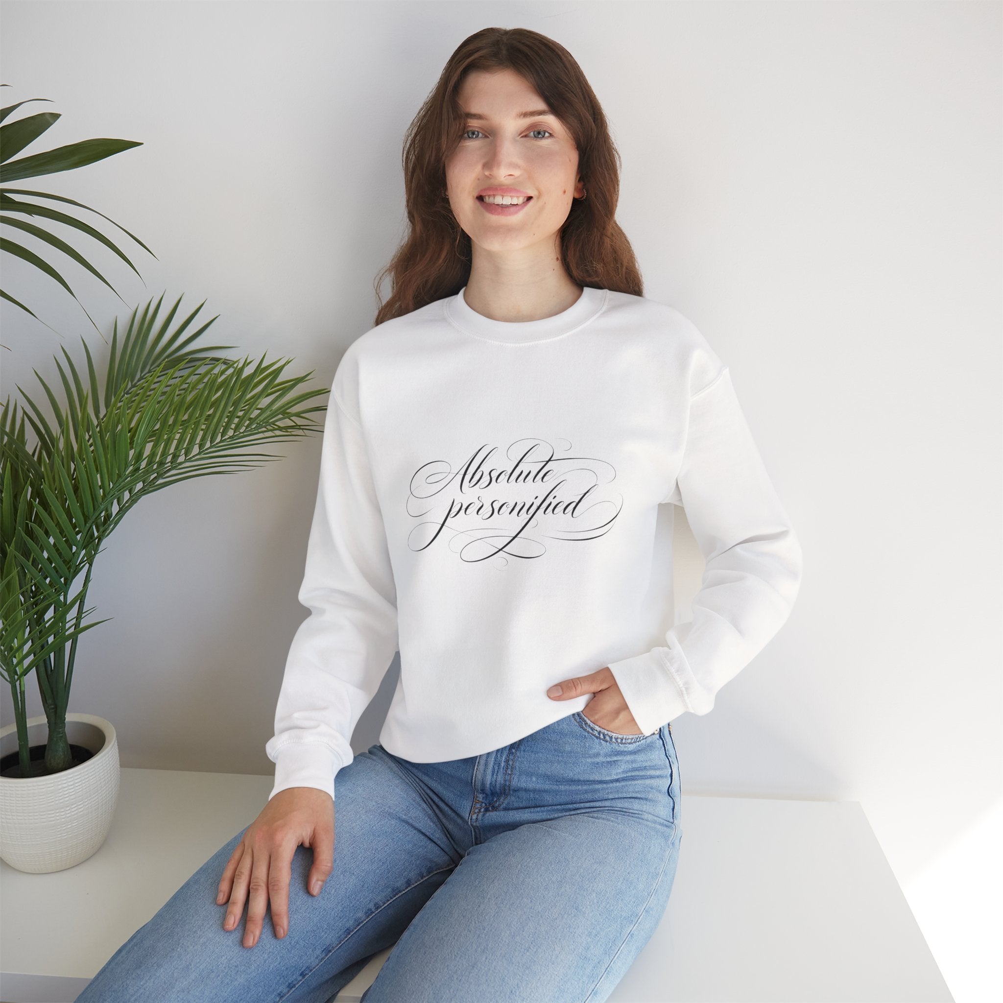 Black crewneck sweatshirt by Printify with "Absolute Perfection" script logo printed on the front.