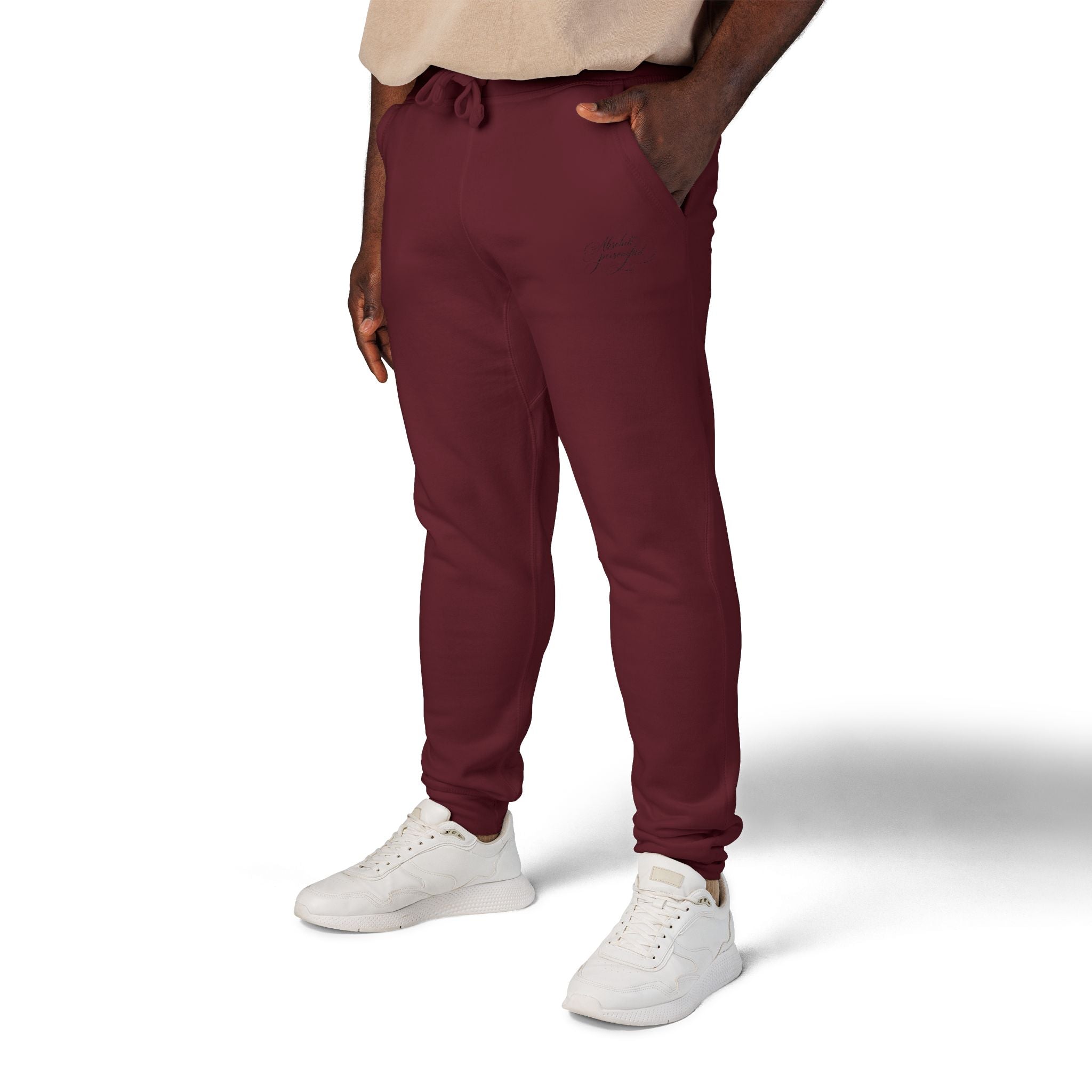 Embroidered black sweatpants with "Absolute Personified" scripted design, casual trousers by Printify on a white background.