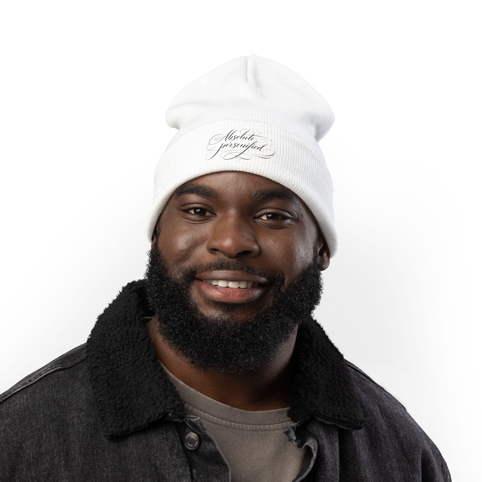 Embroidered black beanie hat with "Absolute Personified" script logo, stylish and cozy accessory by Printify.